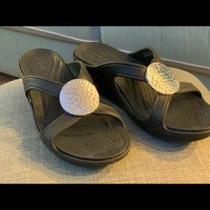 Crocs adorned with hammered metal embellishment